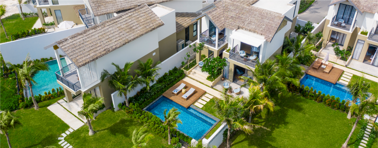 overhead exterior view of a private patio and pool next to a resort building at the New World Phu Quoc Resort in Vietnam