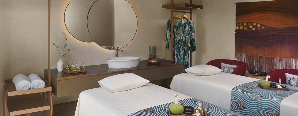 Two beds and a mirror, two sets of nightgowns at The Spa.