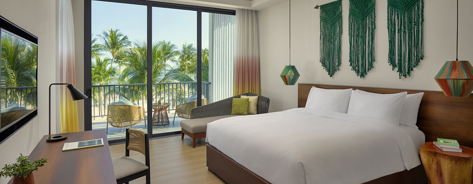 The bedroom with king bed in the second floor leading to beach at the New World Phu Quoc Resort.